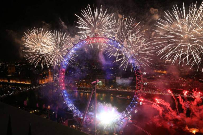 Fireworks explode around the London Eye during the New Year celebrations in central London just after midnight on January 1, 2016. AFP PHOTO / JUSTIN TALLISJUSTIN TALLIS/AFP/Getty Images