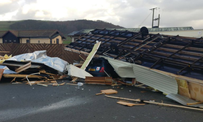 A 'tornado' has caused serious damage on the Welsh coast as strong winds batter Wales. Pictured here is the aftermath of the storm, which has caused serious damage to a holiday village in Clarach Bay, near Aberystwyth. © Thomas Scarrott /WALES NEWS SERVICE