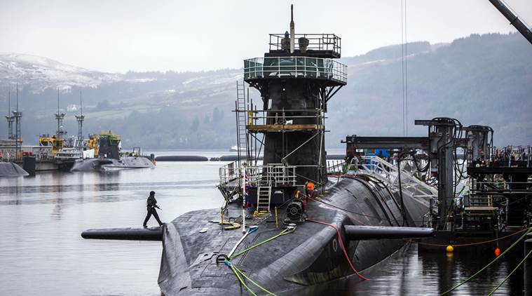 FILE - This Jan. 20, 2016 file photo shows the Vanguard-class submarine HMS Vigilant, one of four Royal Navy submarines armed with Trident missiles, at HM Naval Base Clyde, also known as Faslane, Scotland. British lawmakers are due to vote Monday July 18, 2016, on whether to replace the country's fleet of nuclear-armed submarines, a powerful but expensive symbol of the country's military status. (Danny Lawson/PA via AP)