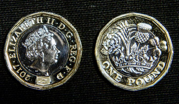 14/03/17 PA File Photo of both faces of the 12-sided one pound coin at the Royal Mint in Llantrisant, Wales. See PA Feature FINANCE New Pound. Picture credit should read: Ben Birchall/PA Photos. WARNING: This picture must only be used to accompany PA Feature FINANCE New Pound